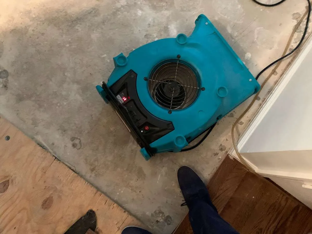 Air mover drying subfloor during Leak Detection & Repair in Lake Zurich